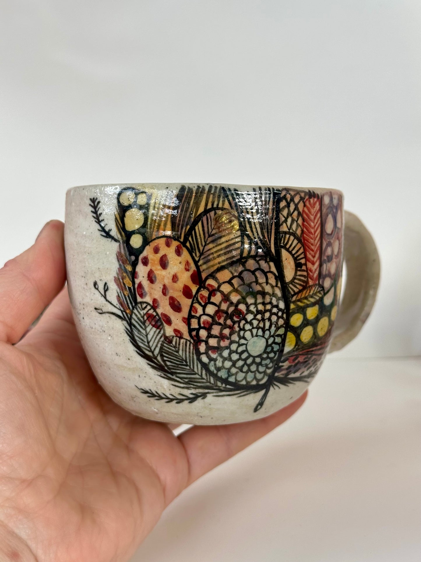 ‘Feather’ hand painted cup