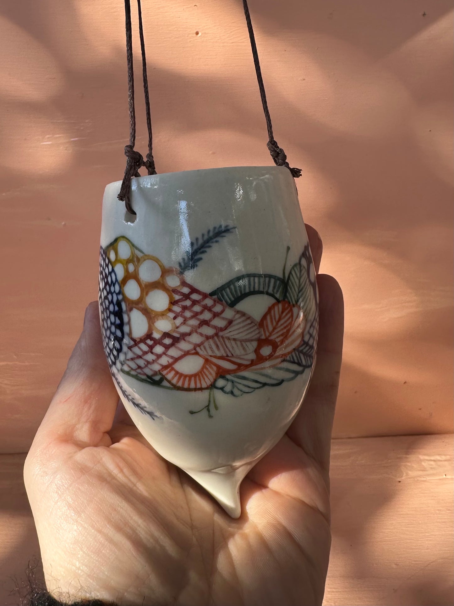 Hand painted porcelain hanging pod
