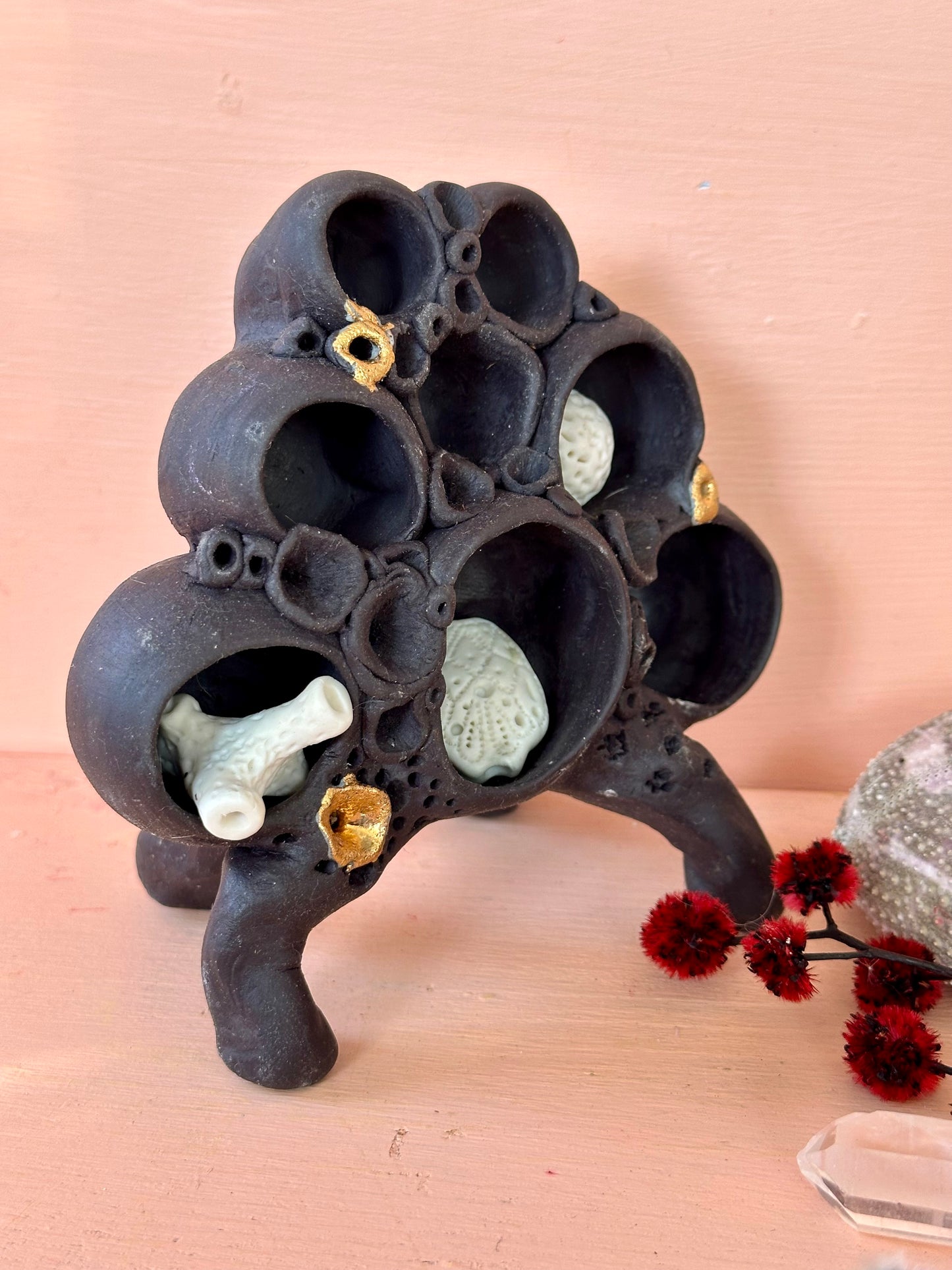 Black clay ‘treasure shelf’ with coral accents & accessories