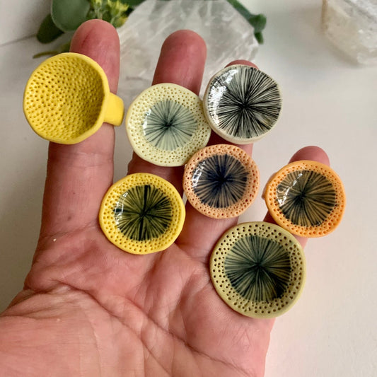 One yellow / orange porcelain ‘star’ or ‘coral dot’ ring