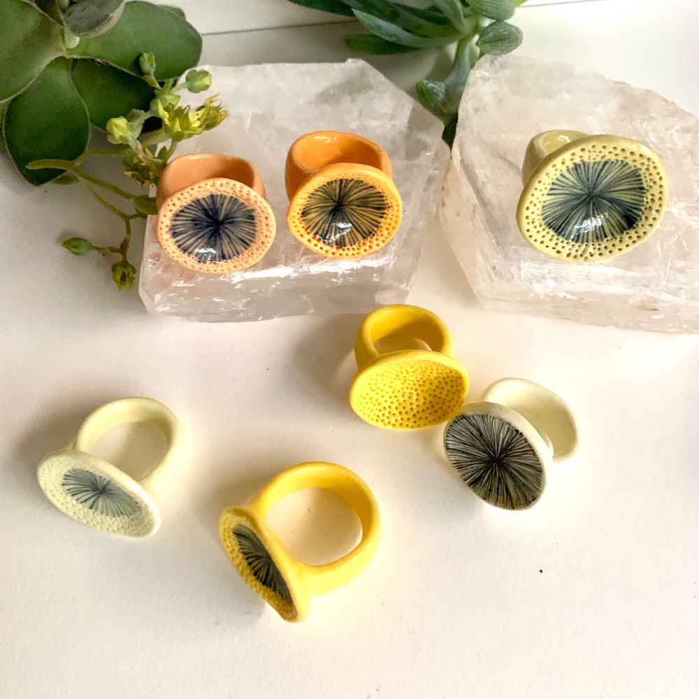 One yellow / orange porcelain ‘star’ or ‘coral dot’ ring