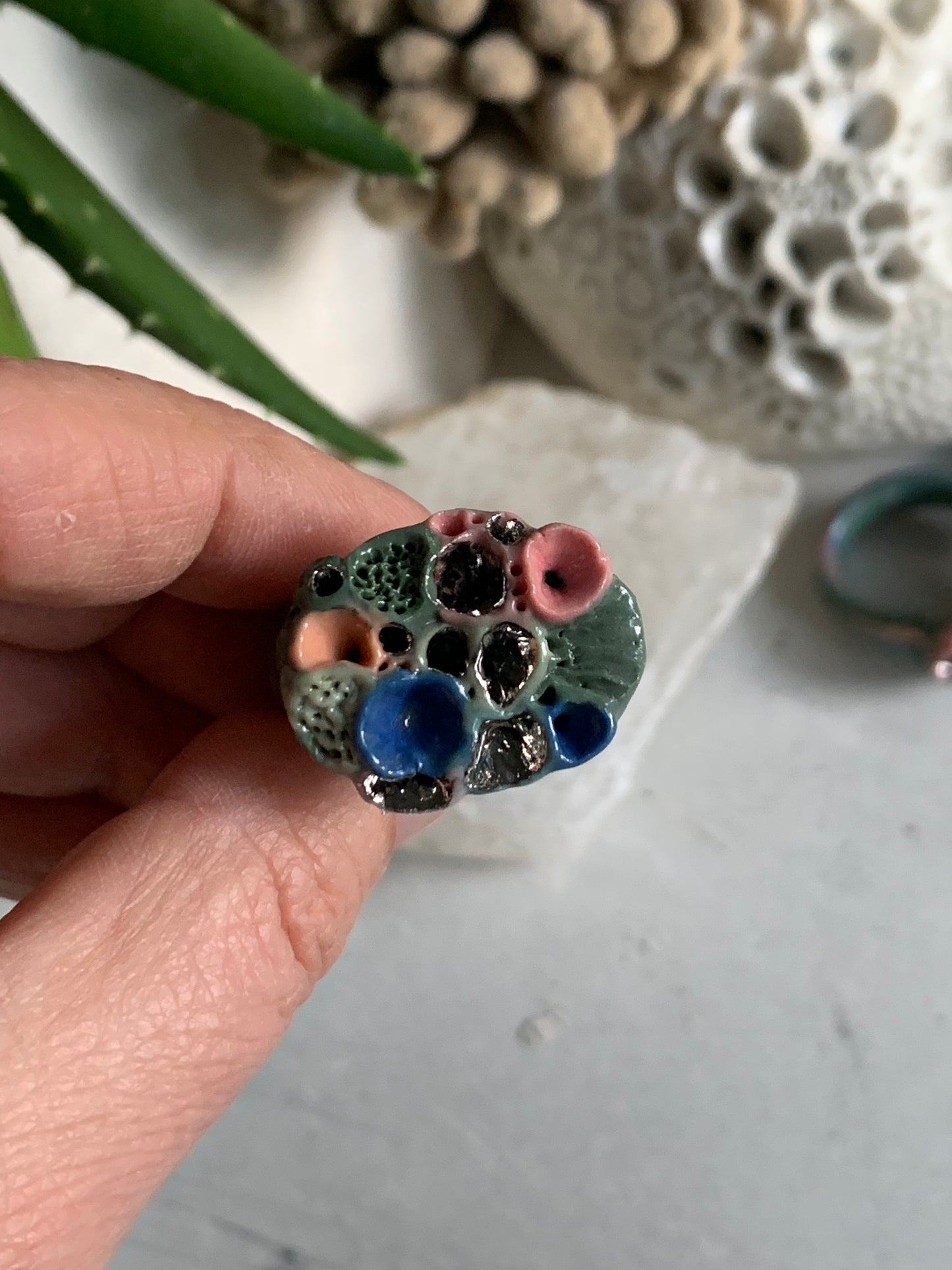 Green tones porcelain ‘rock coral’ ring with platinum detail- larger sizes. choose a size