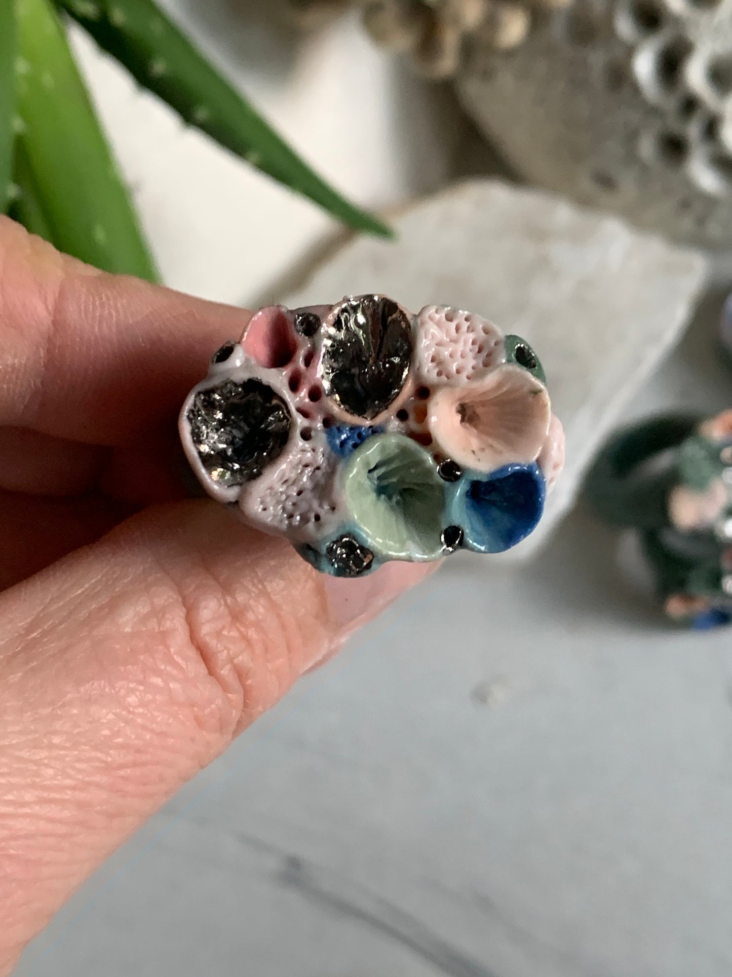 Green tones porcelain ‘rock coral’ ring with platinum detail- larger sizes. choose a size