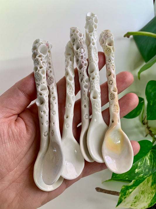 One Porcelain hand formed ‘coral’ spoon