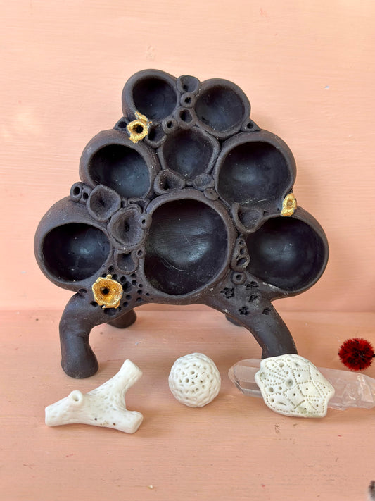 Black clay  ‘treasure shelf’ with coral accents & accessories
