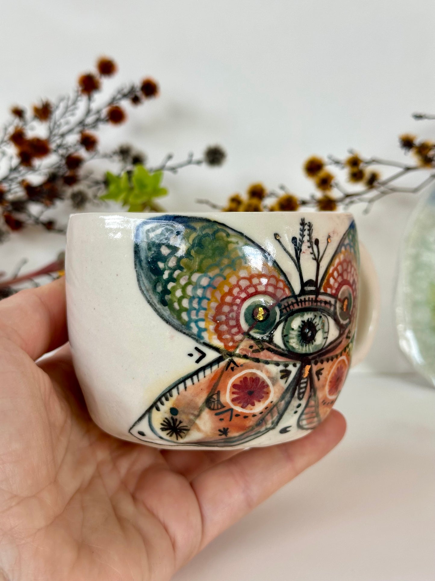 ‘moth’ hand painted cup