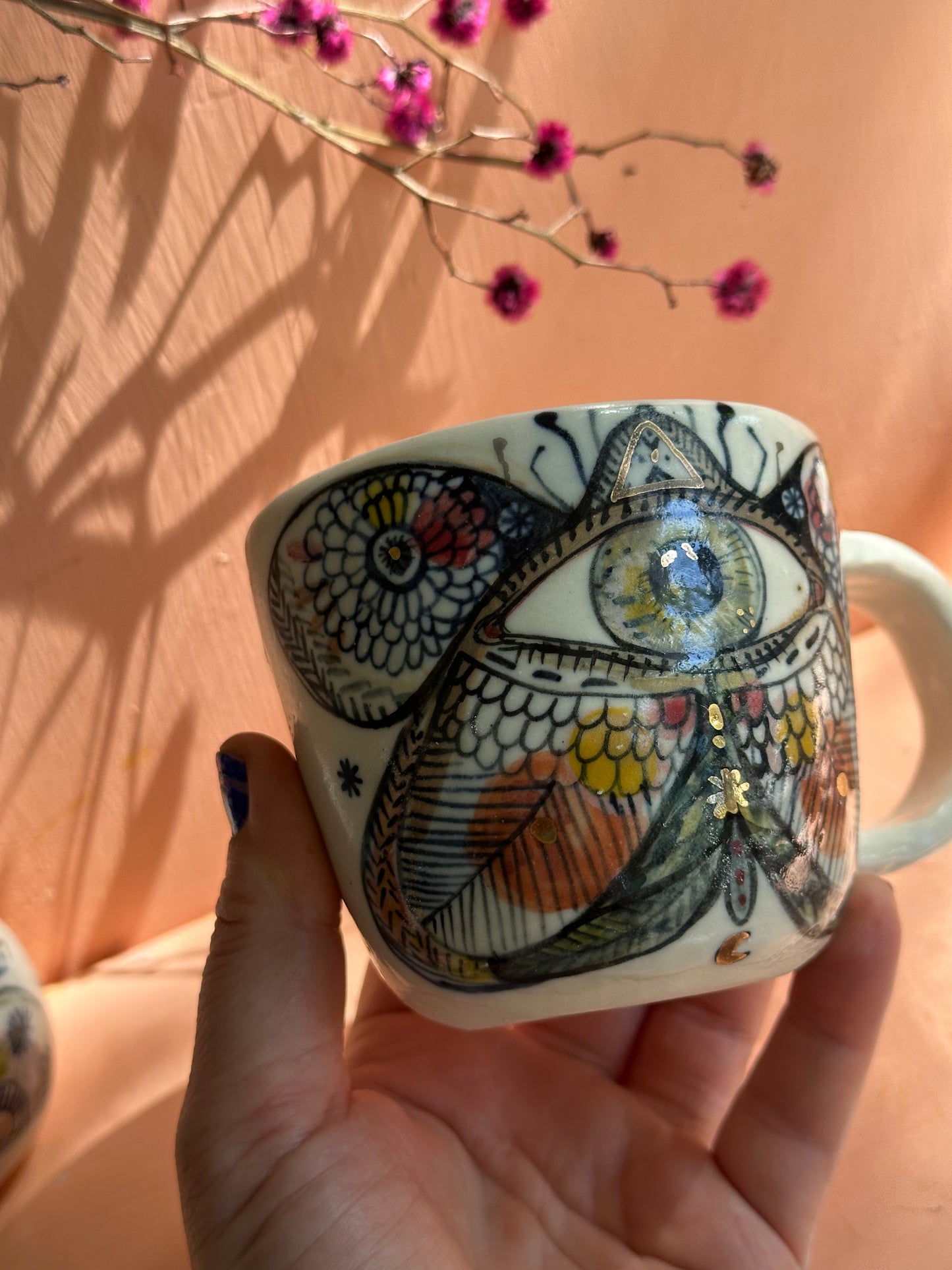 One ‘moth’ hand painted cup