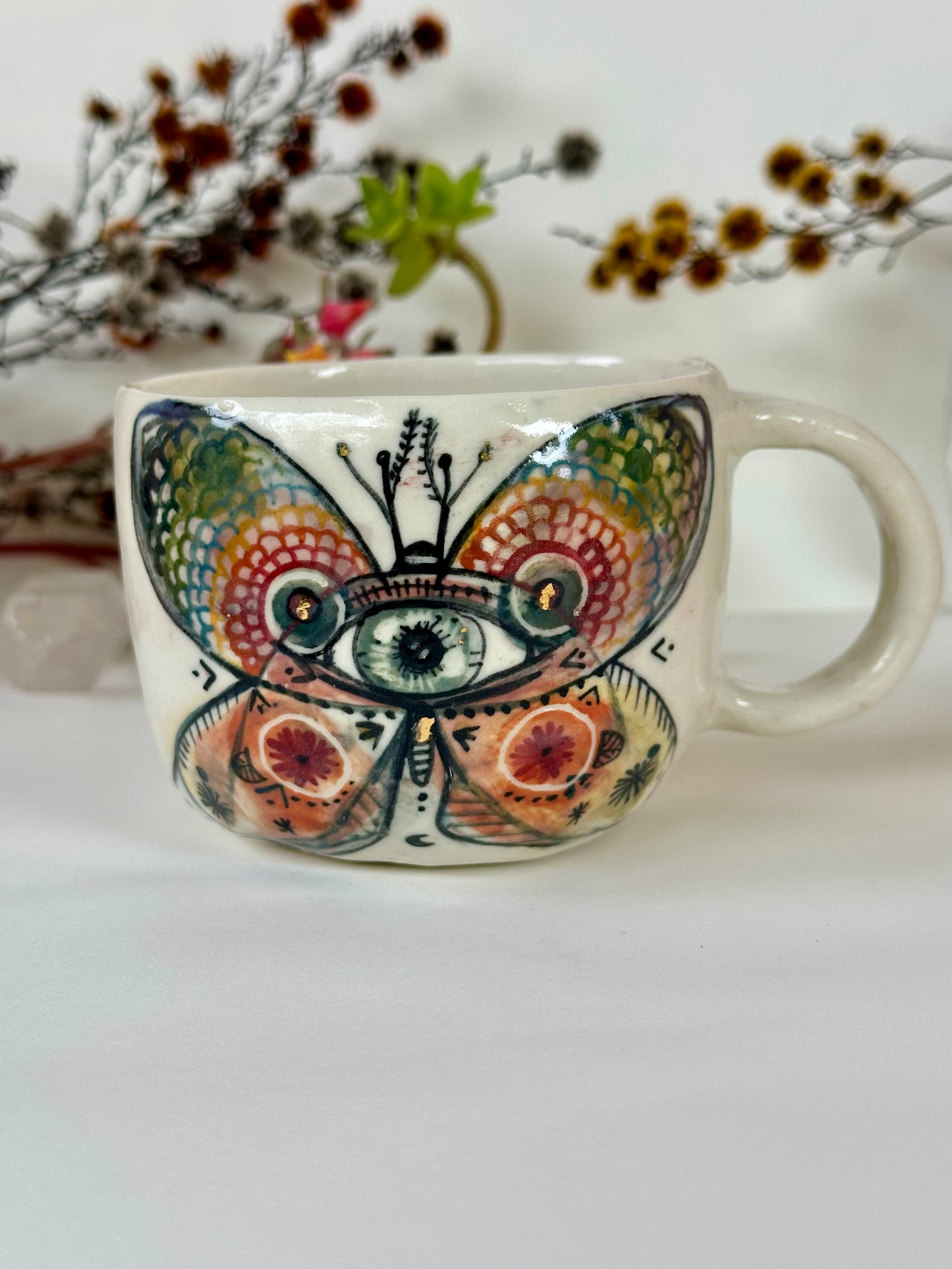 ‘moth’ hand painted cup
