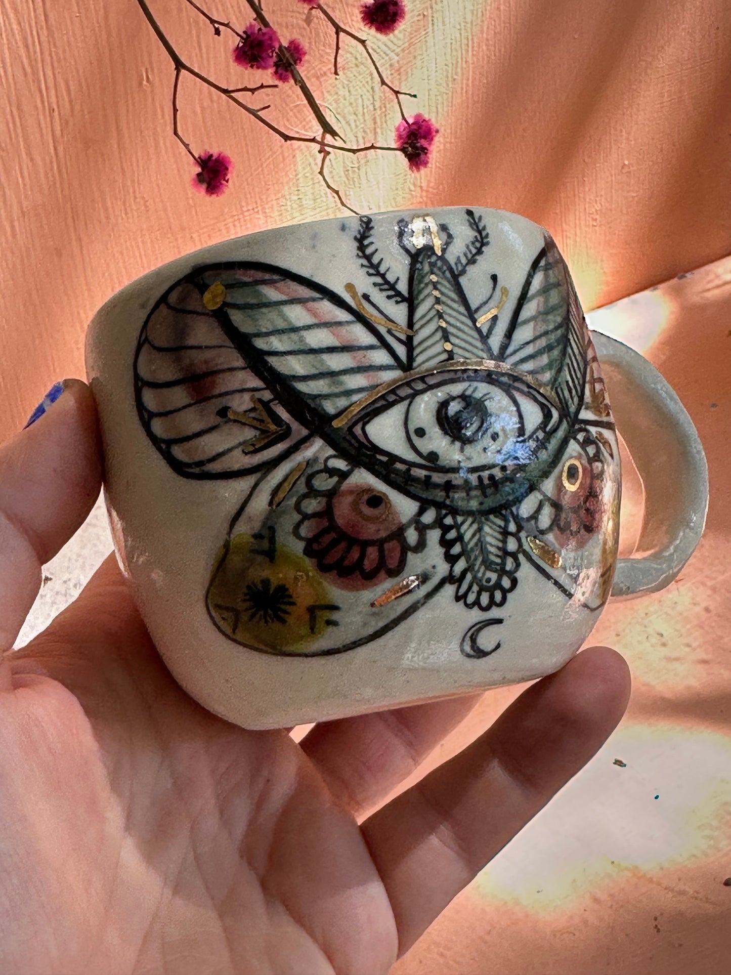 ‘moth’ hand painted cup