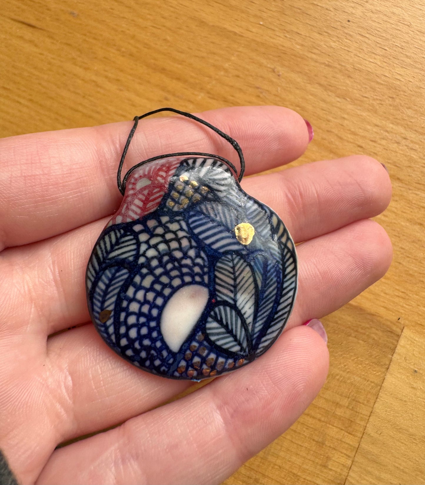 Hand Detailed Pendant with Gold Lustre