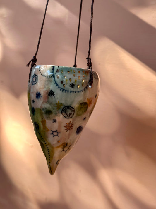 Hand painted ‘stars and cells’ porcelain hanging pod