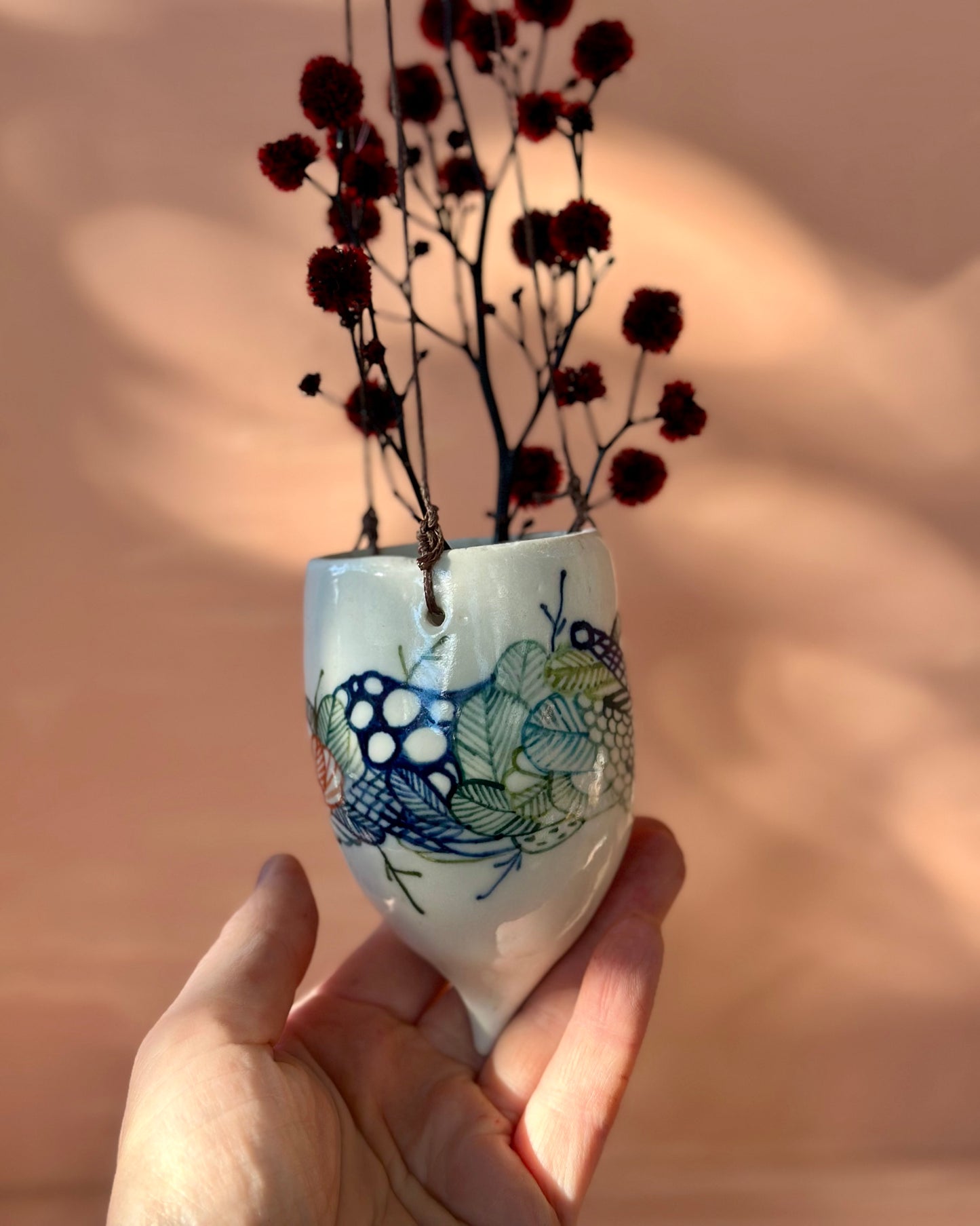 Hand painted porcelain hanging pod