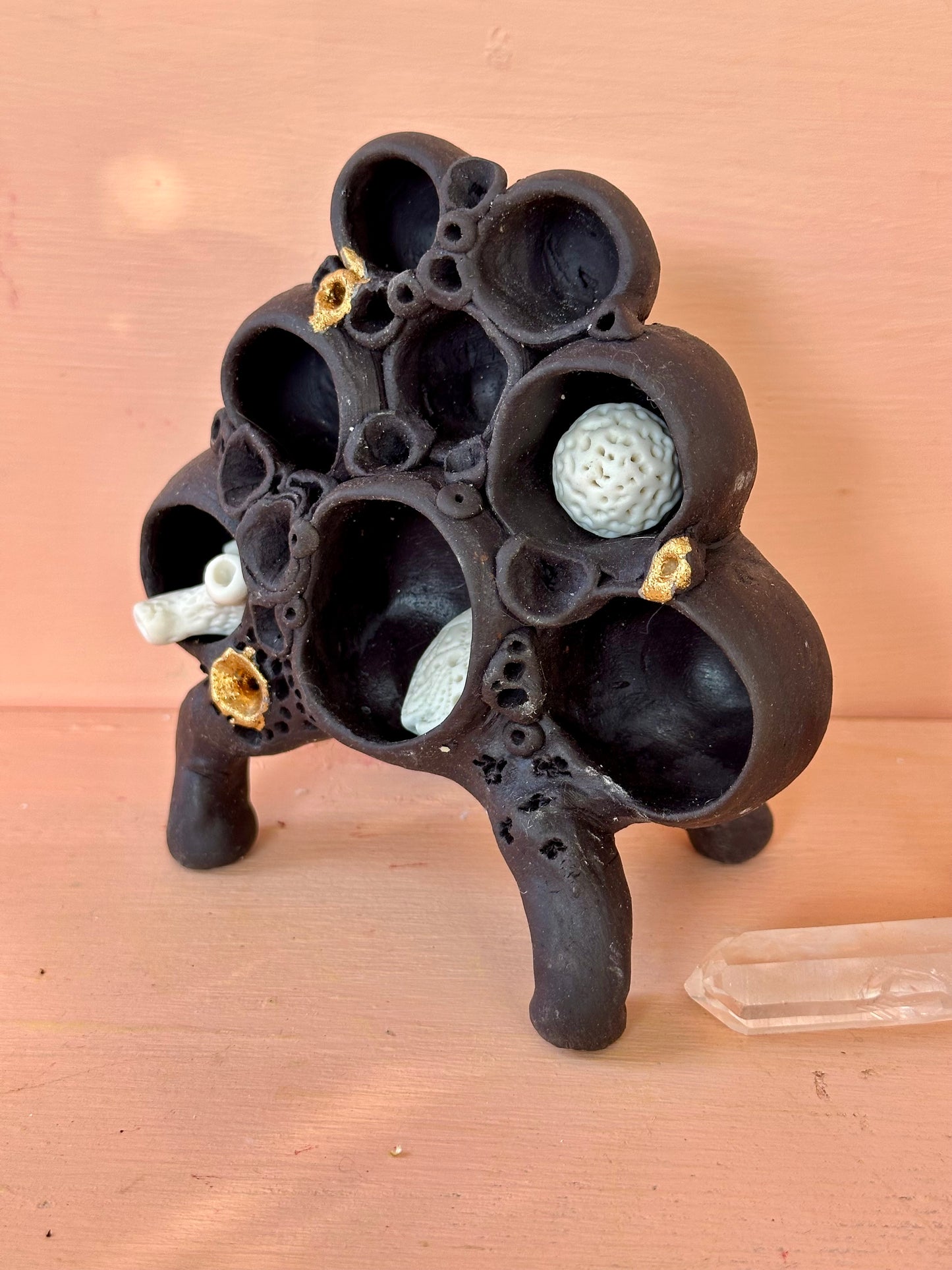 Black clay  ‘treasure shelf’ with coral accents & accessories