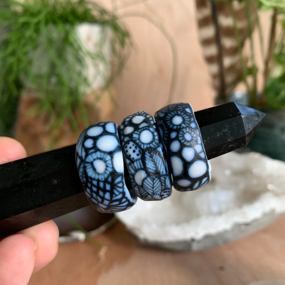 One blue and white ‘seafoam’ band ring