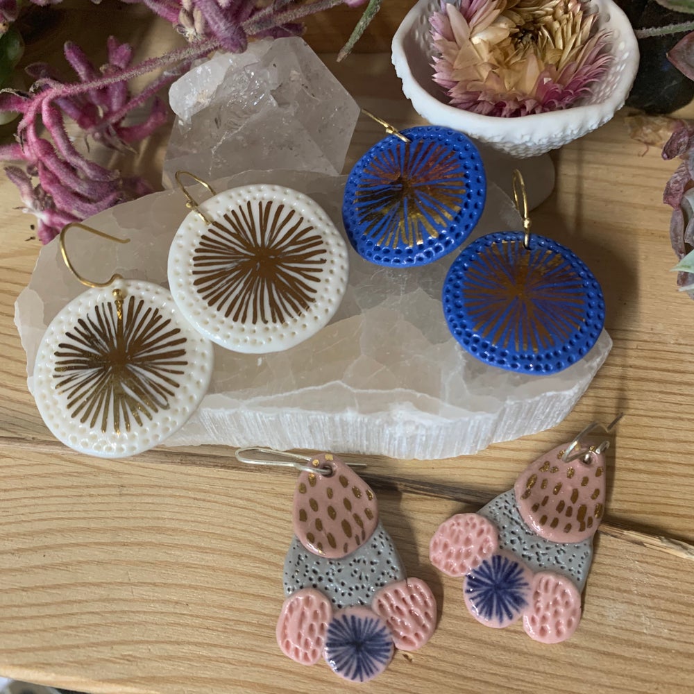 Coloured porcelain earrings, with painted lustre details.