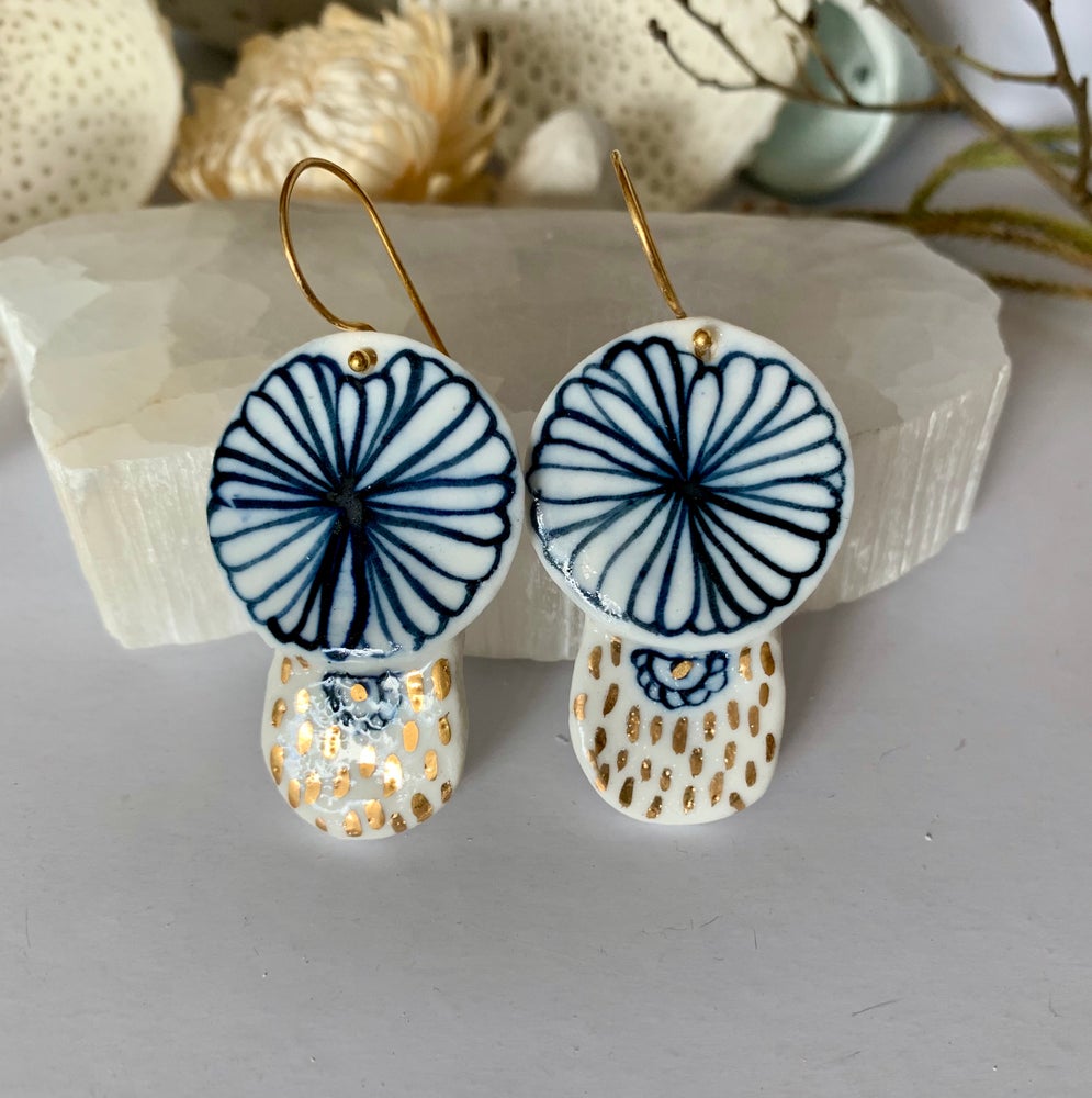 Blue and white hand painted porcelain earrings with gold lustre detail.