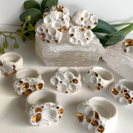 One white and gold ‘rock coral’ porcelain ring