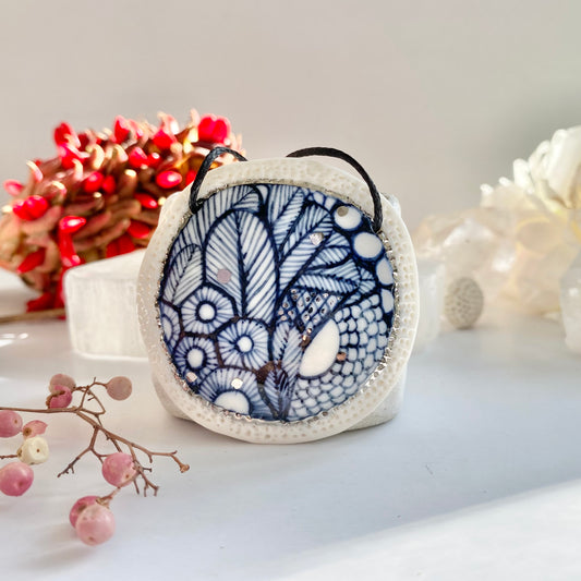 Indigo ‘sea foam’ pendant with silver detail