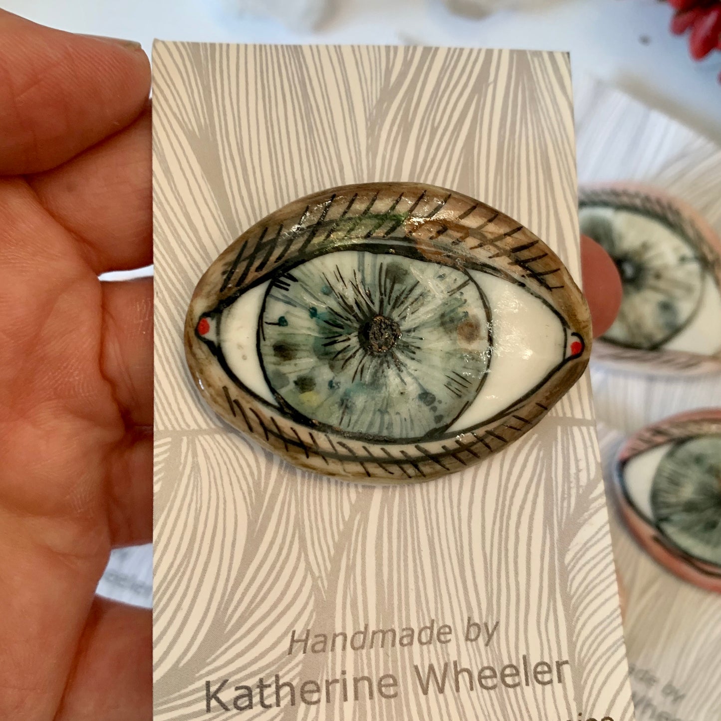 ‘The protective eye’ handpainted porcelain brooch, choose one